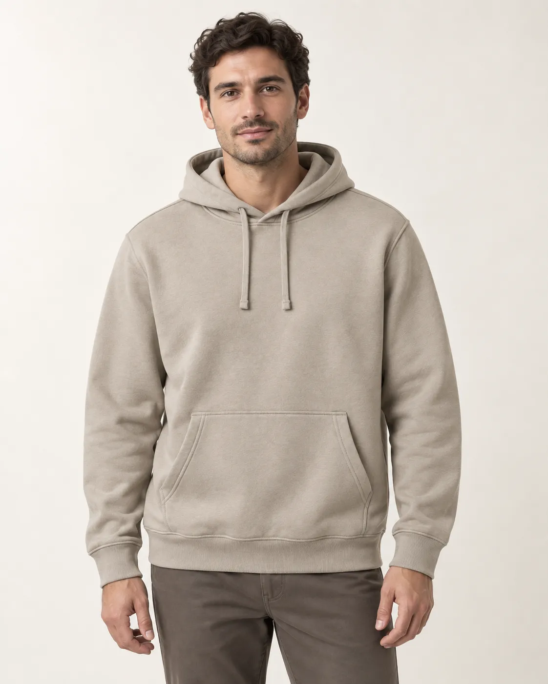 Front view of a model wearing a stone-colored pullover hoodie