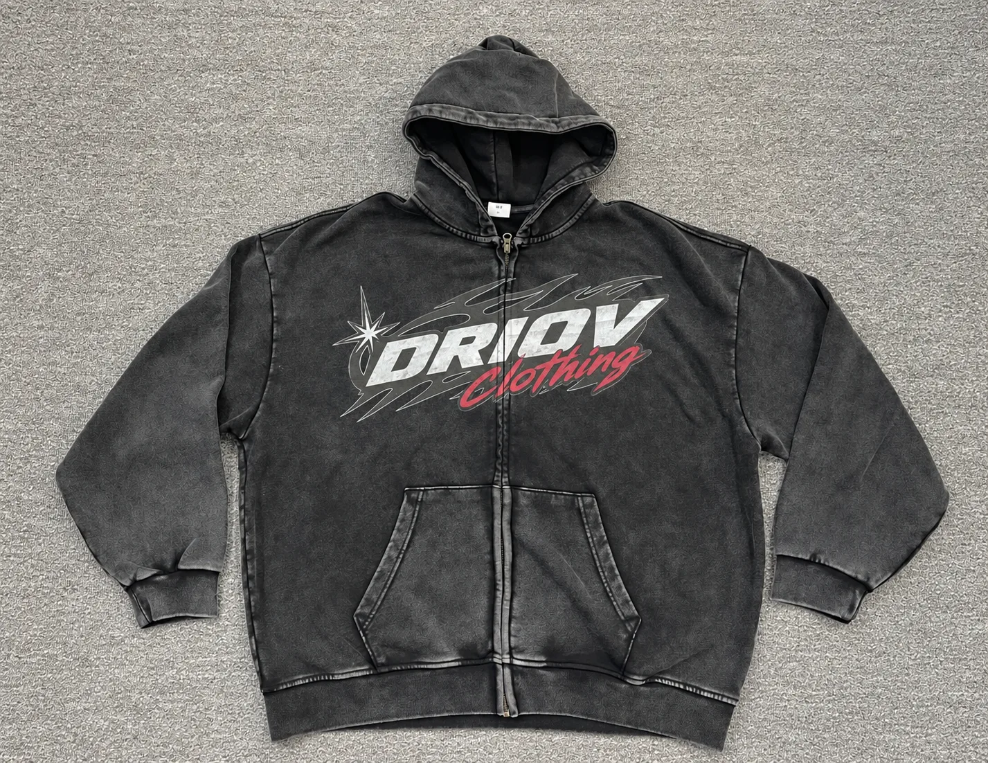 Dark zip hoodie with a white and red DRIOV Clothing chest graphic.