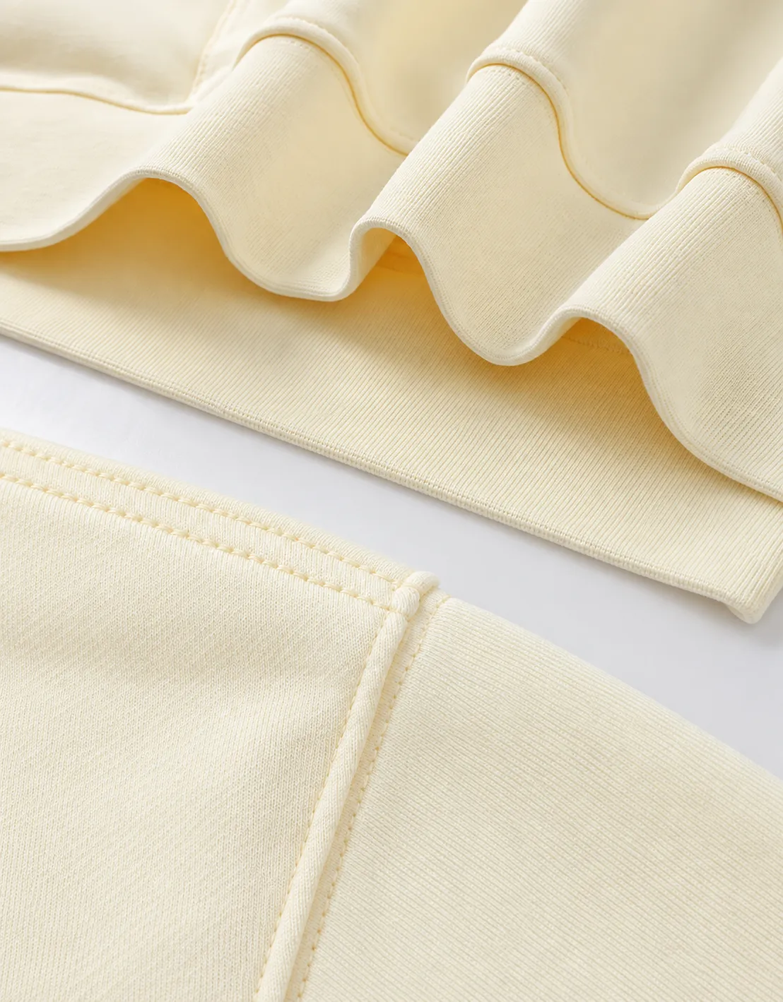 A closer look at the ribbed hem, stitching and pocket construction.